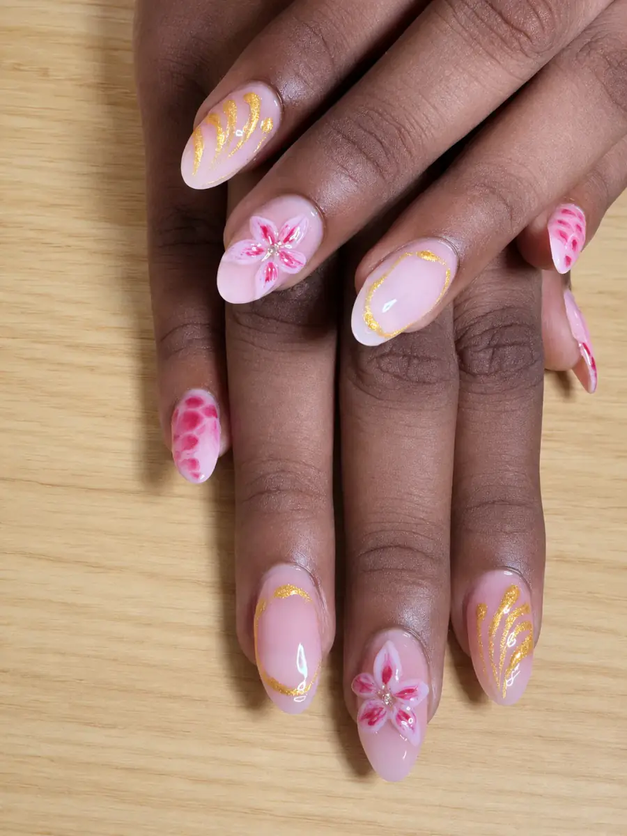 Detailed pink and gold floral manicure created by Bia